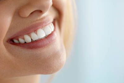 woman showing off her smile after services from Glendale Dental Associates