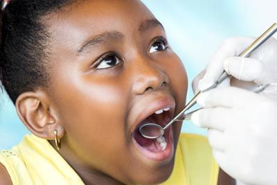 young patient getting her teeth checked at Glendale Dental Associates